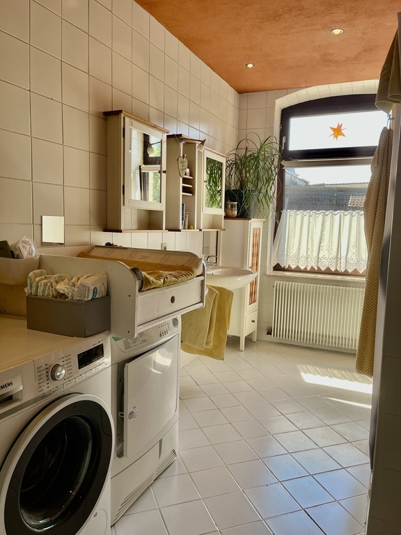 downstairs bathroom with bathtub and shower