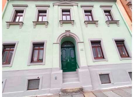 The front of our house. The entire building belongs to our family.