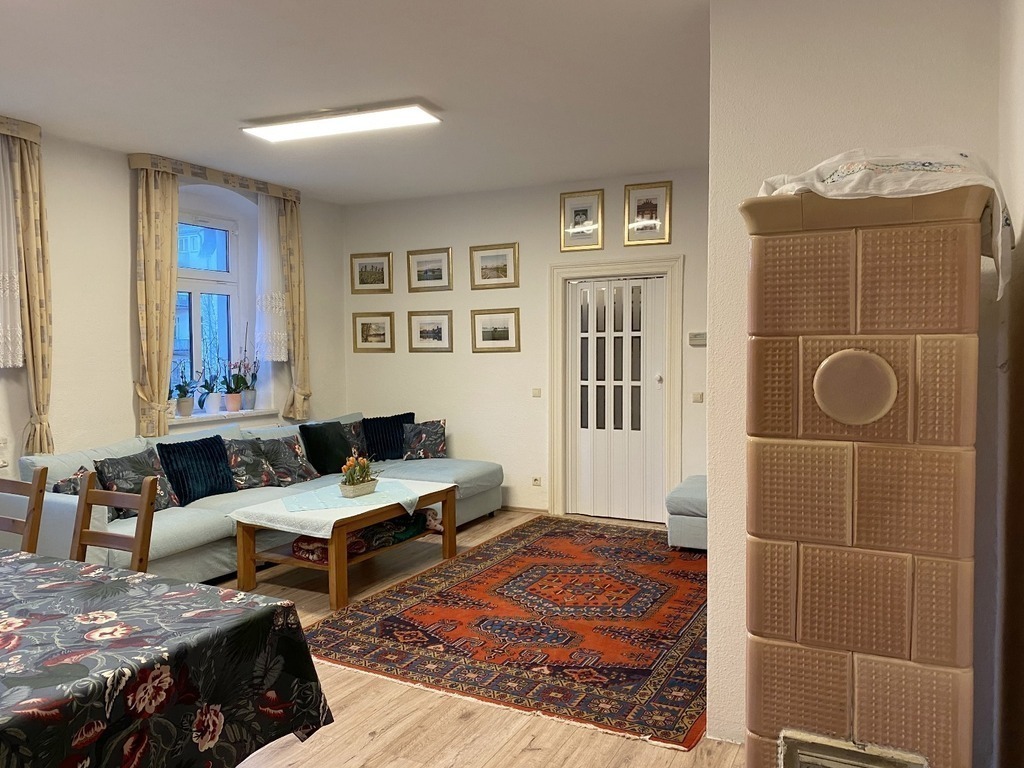 living room with dining area and TV area and lounge.
