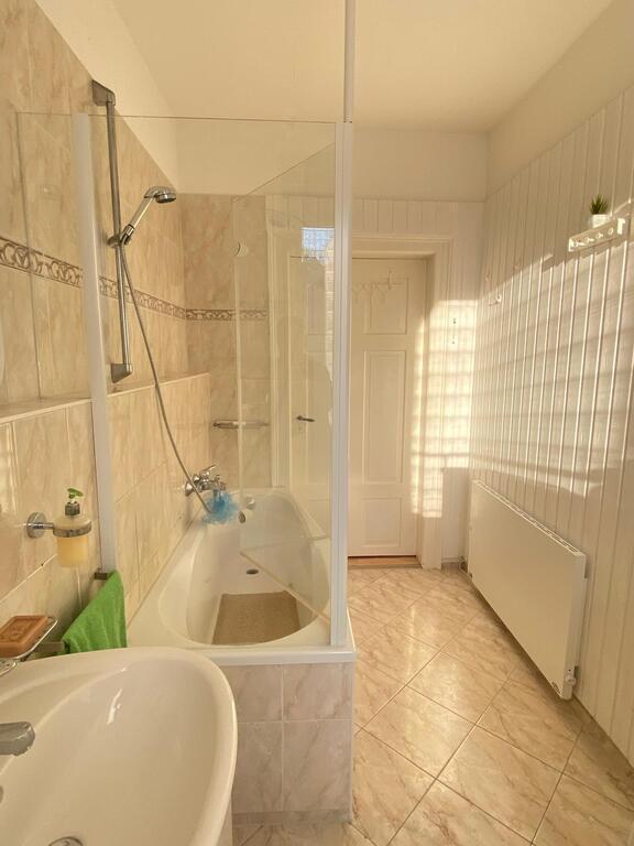 The bathroom is spacious. In addition, there is the possibility of taking a bath and also a shower.