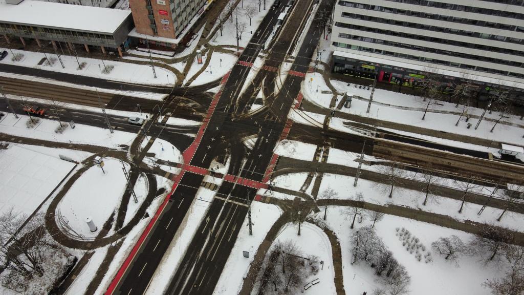 A nice picture of the streets in the centre with snow.
