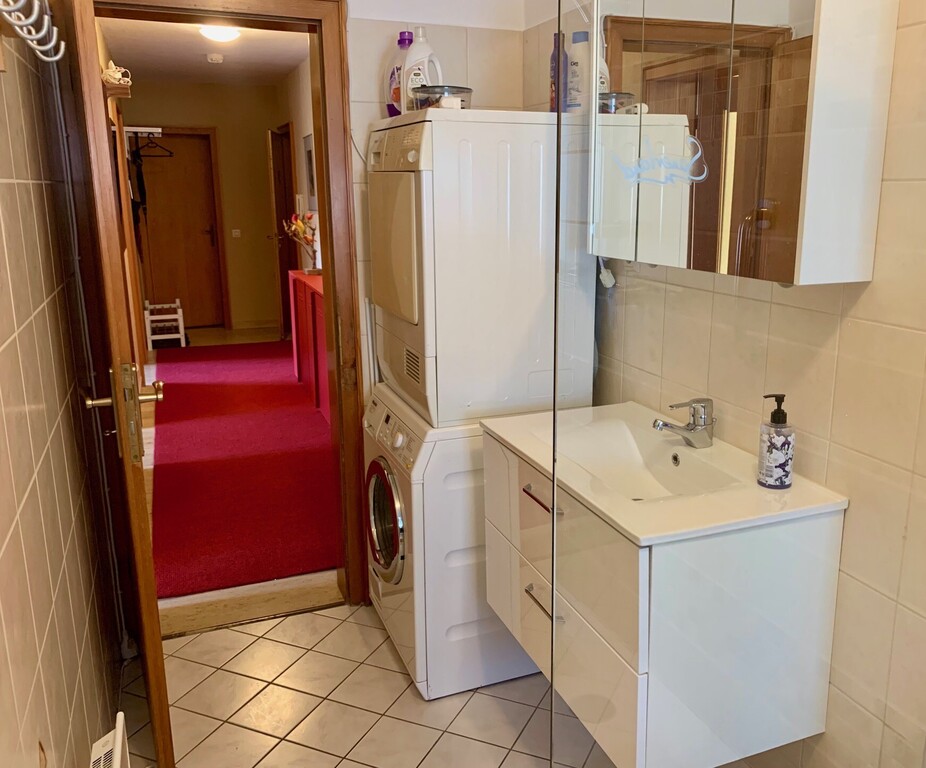 Bathroom with washing machine and dryer