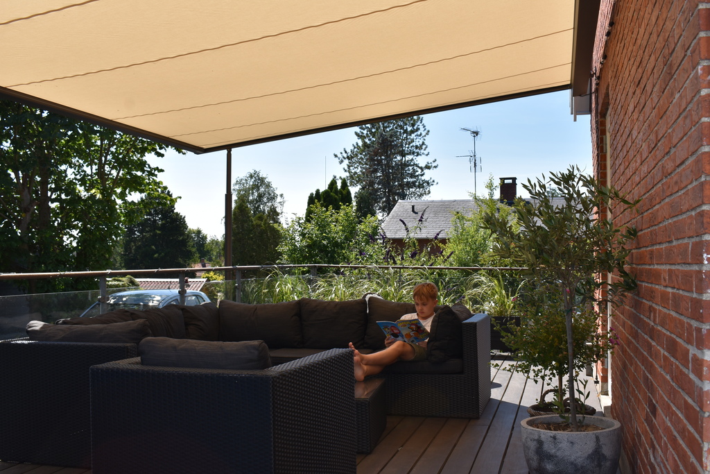 Wooden terrace with outdoor lounge furniture