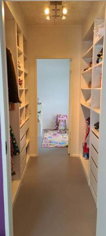 Walk though closet between the girls rooms