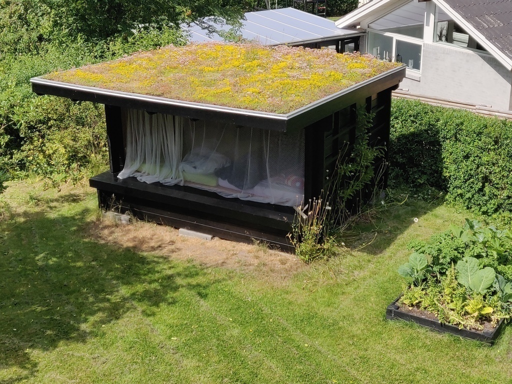 We have a shelter in the garden with room for four persons.