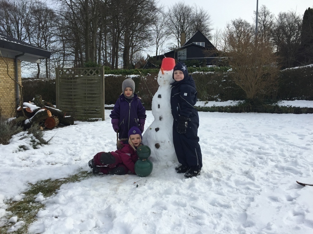 Bjørn and Rigmor (sitting) with a friend in the winter