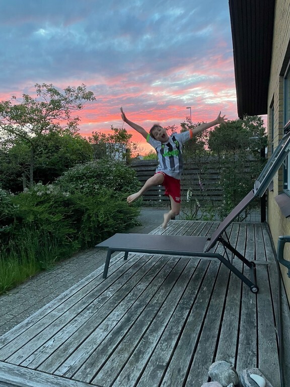 Nice sunset and happy boy - front garden 2022