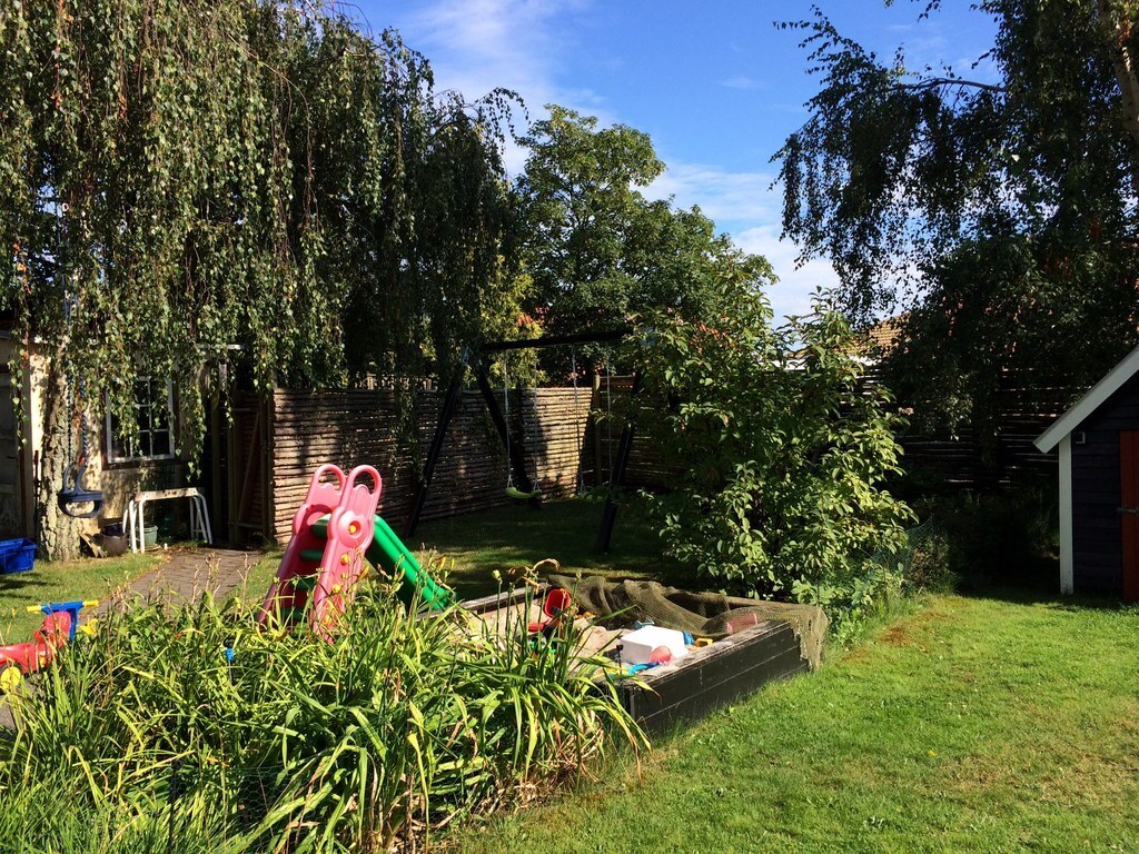 Part of the back garden - currently with swings, sandpit and playhouse