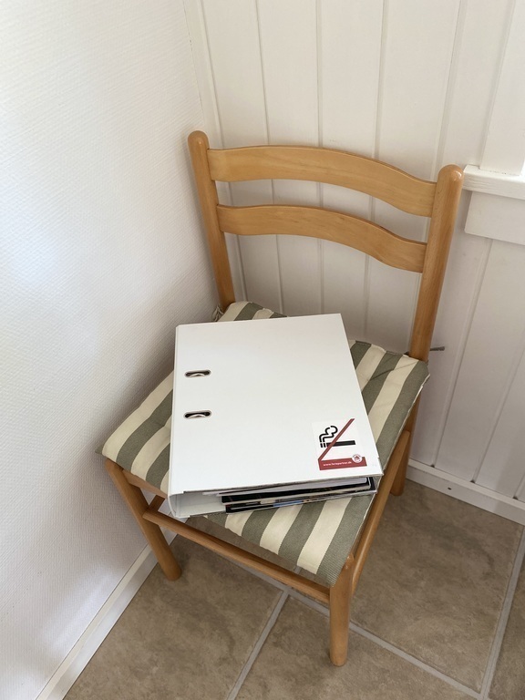 Mappen med information om huset.