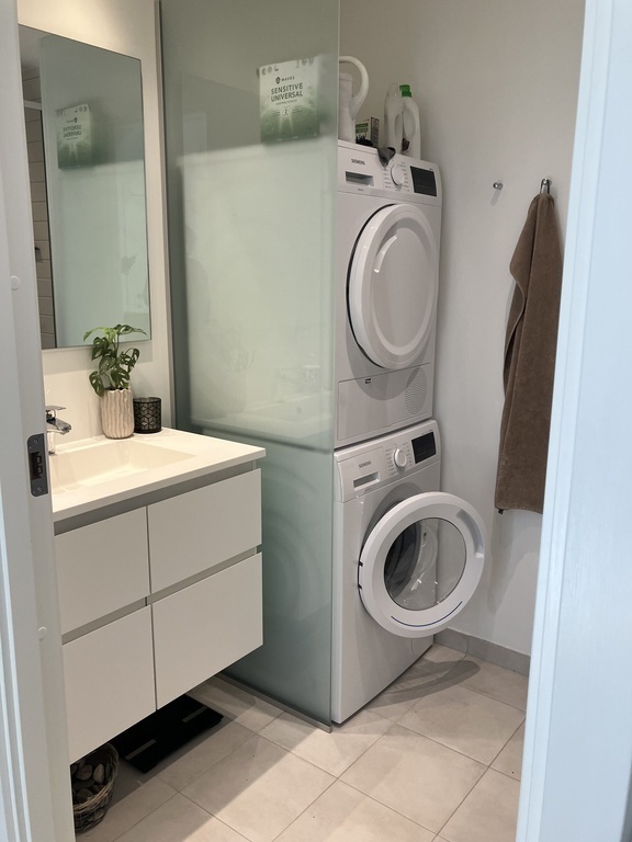 Toilet at 1. floor with washing machine and dryer
