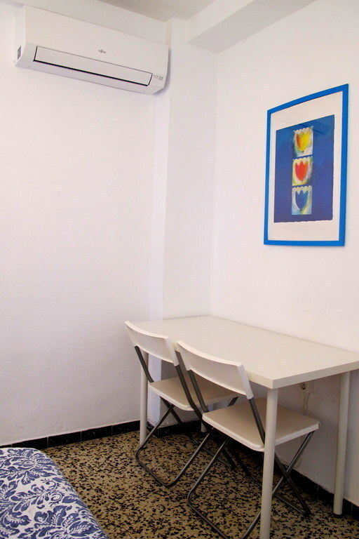 the master bedroom with a table and airconditioning