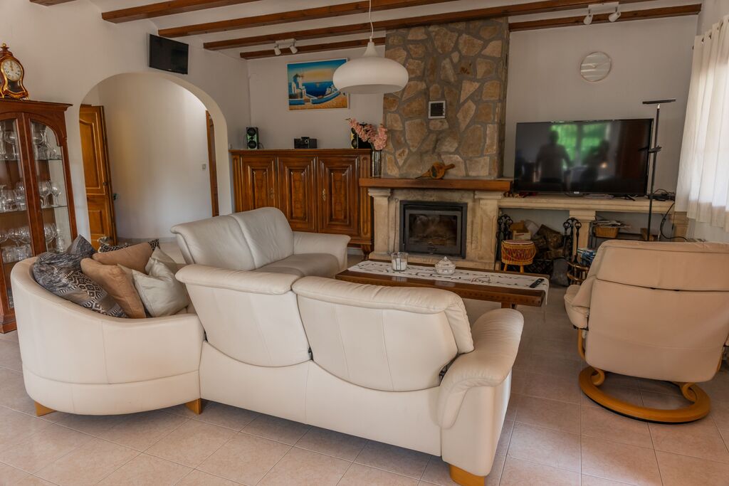 Living Room with Sofa, TV and Chimney