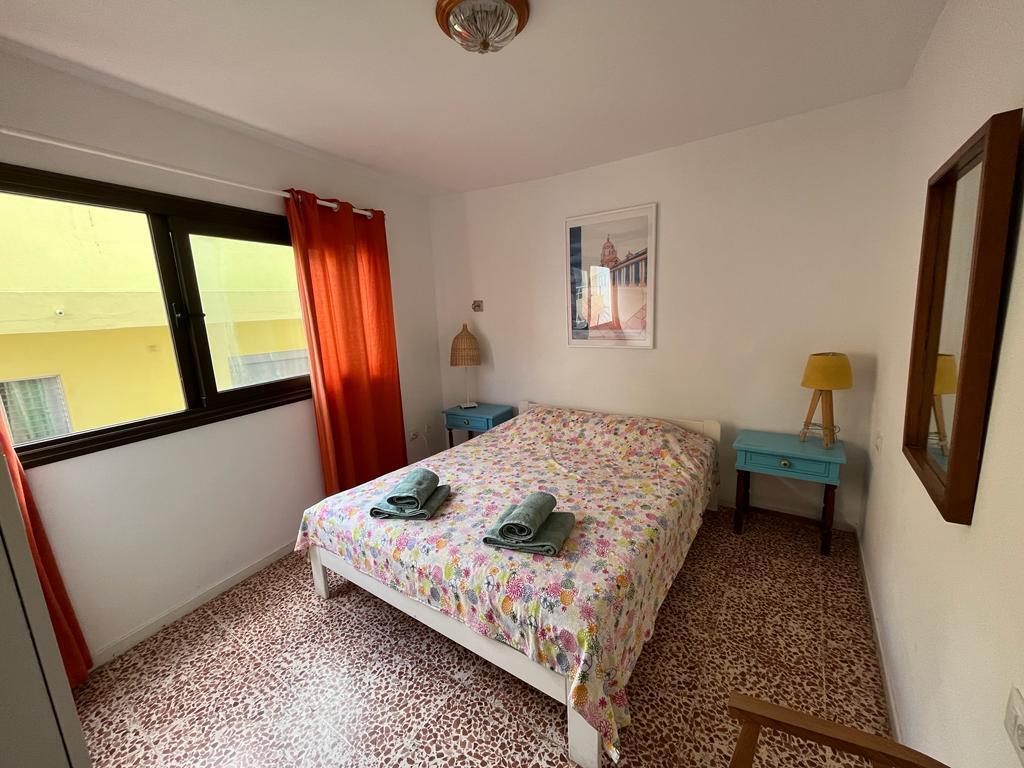 The main bedroom offers a partial sea view.