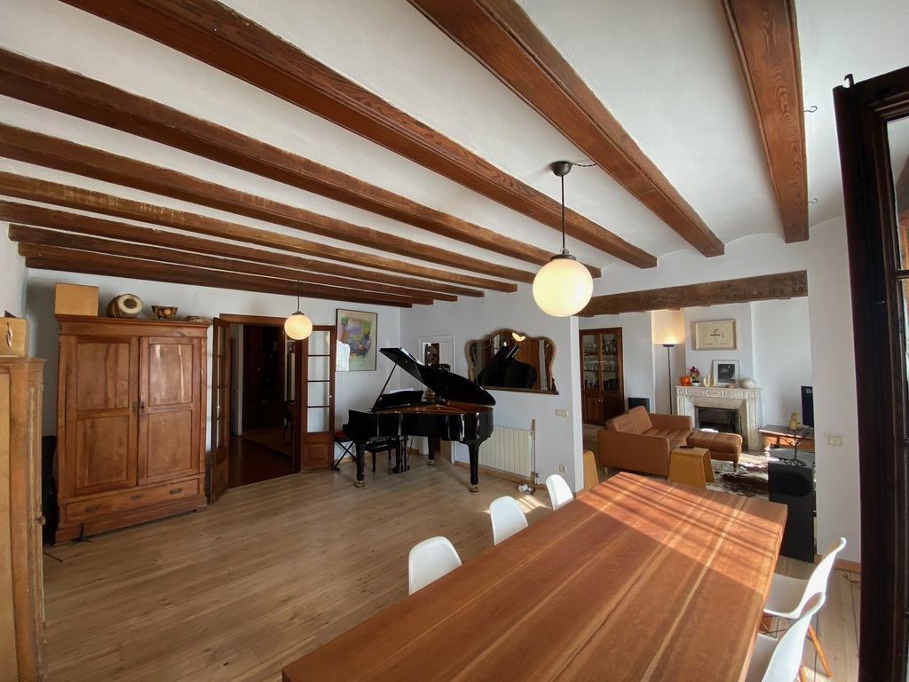 (Downstairs) Living Room Space 2, with piano and large dining table - 2/5