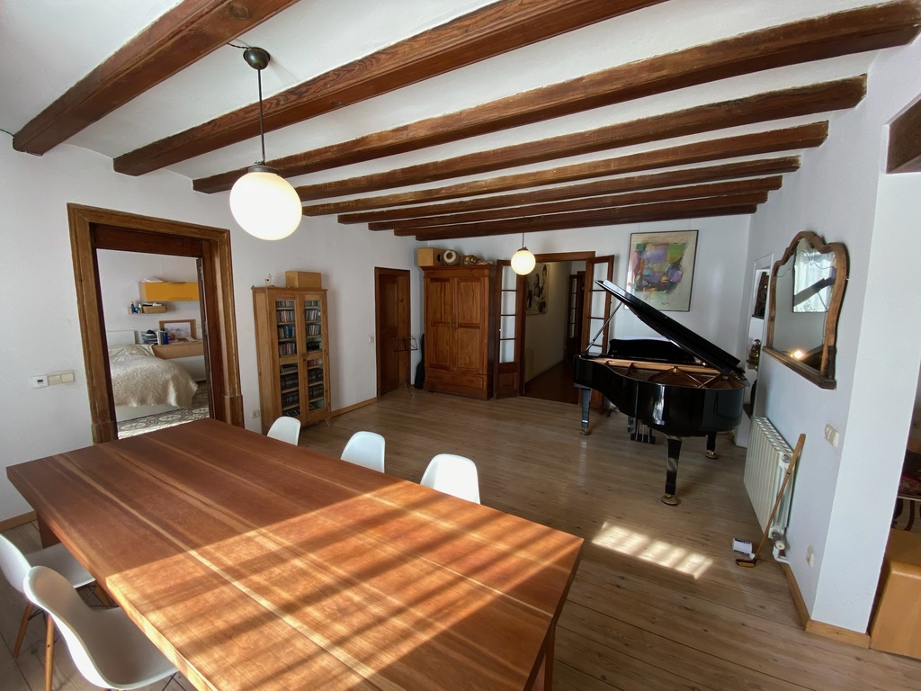 (Downstairs) Living Room Space 2, with piano and large dining table - 3/5
