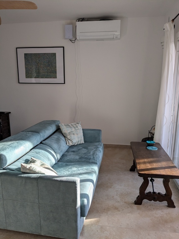 living area (sofa & airconditioning)
