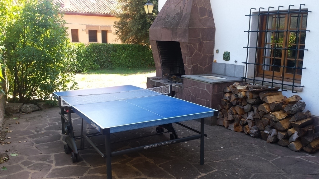 At the rear of the house we have a big and useful barbacue and a table tennis