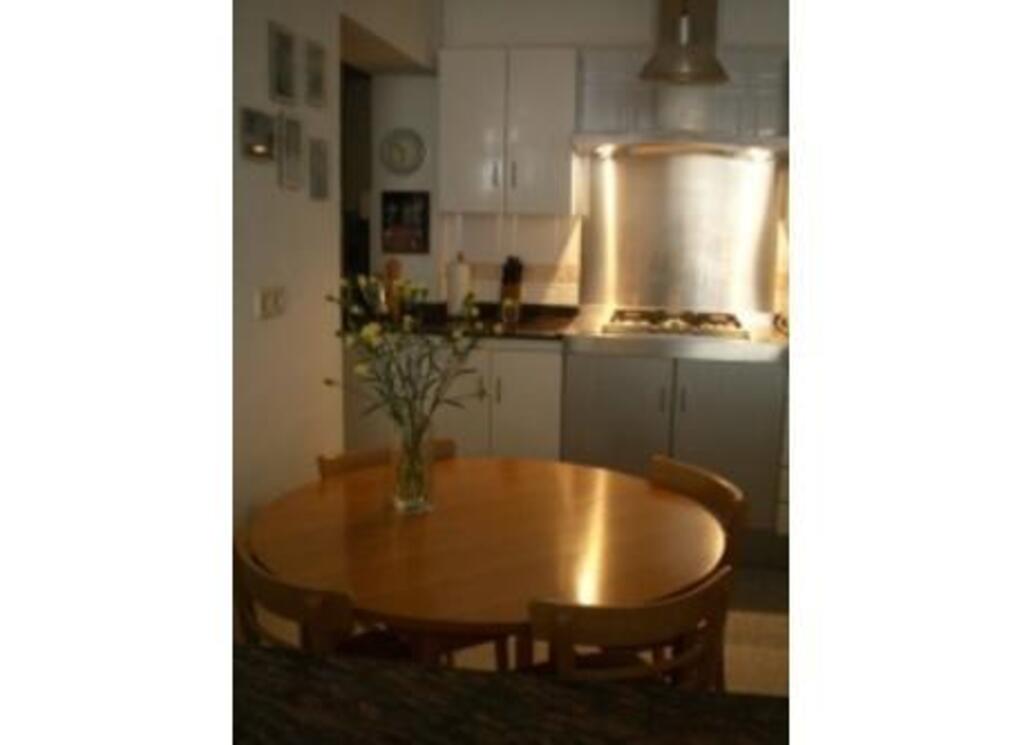 Open plan, well-equipped kitchen.