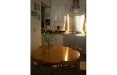 Open plan, well-equipped kitchen.