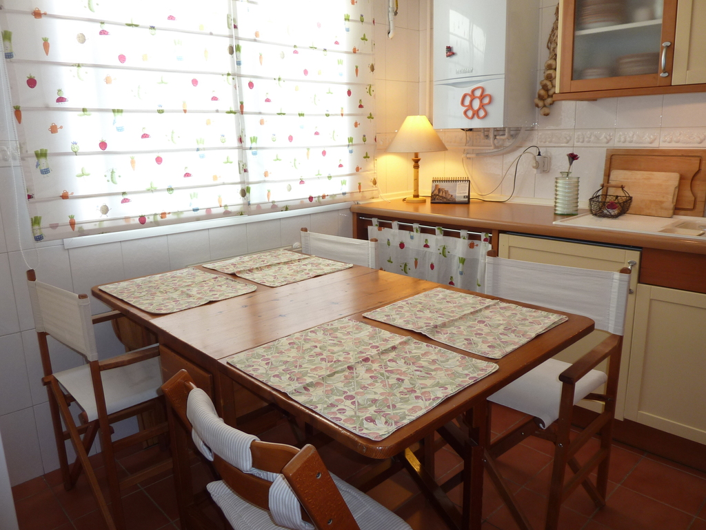 Eating table in the kitchen sits comfortably 4 adults