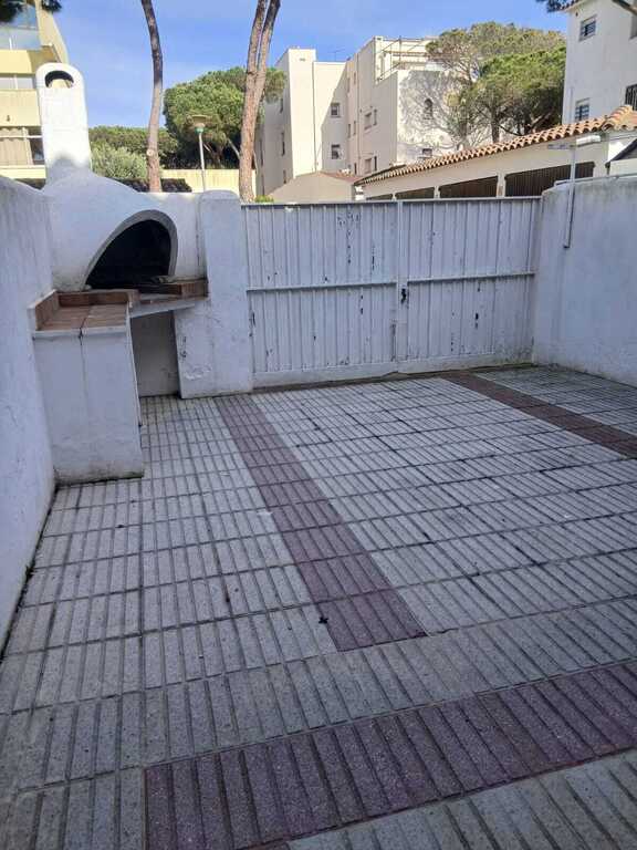 Patio tasero con barbacoa
