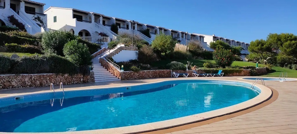 Large pool with childrens pool next to it with spacious lawned area to relax in the sun, loungers provided.