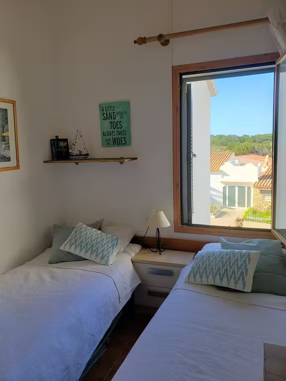 Comfortable twin bedroom with good storage space and lots of natural light, also with shutters on the window so ideal for little