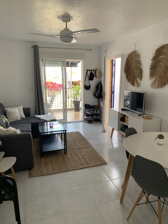 Next to the living room there is a balcony.