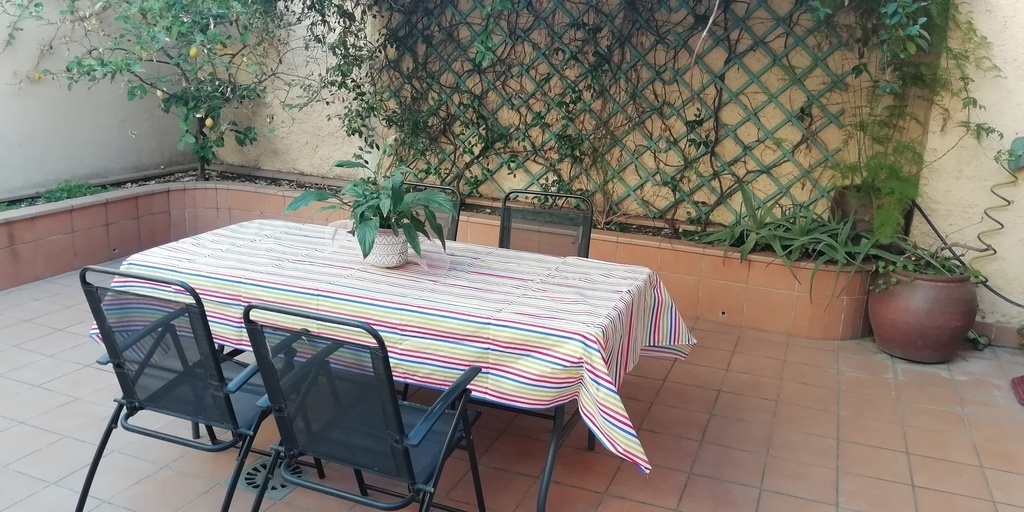 A table prepared to have a meal in our patio