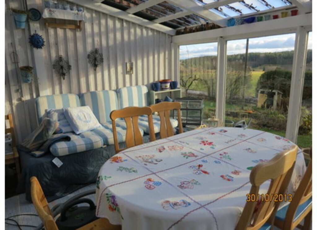 Sun room, a favorite place for dining and meeting our guests in summertime.