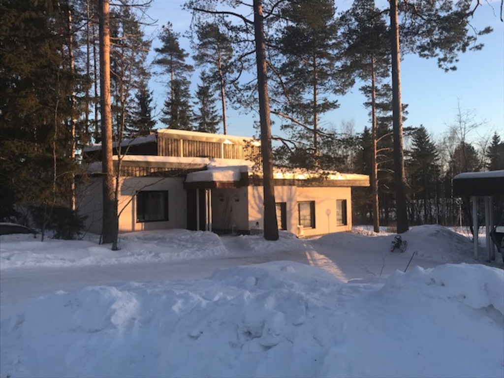 House seen from the street during wintertime.