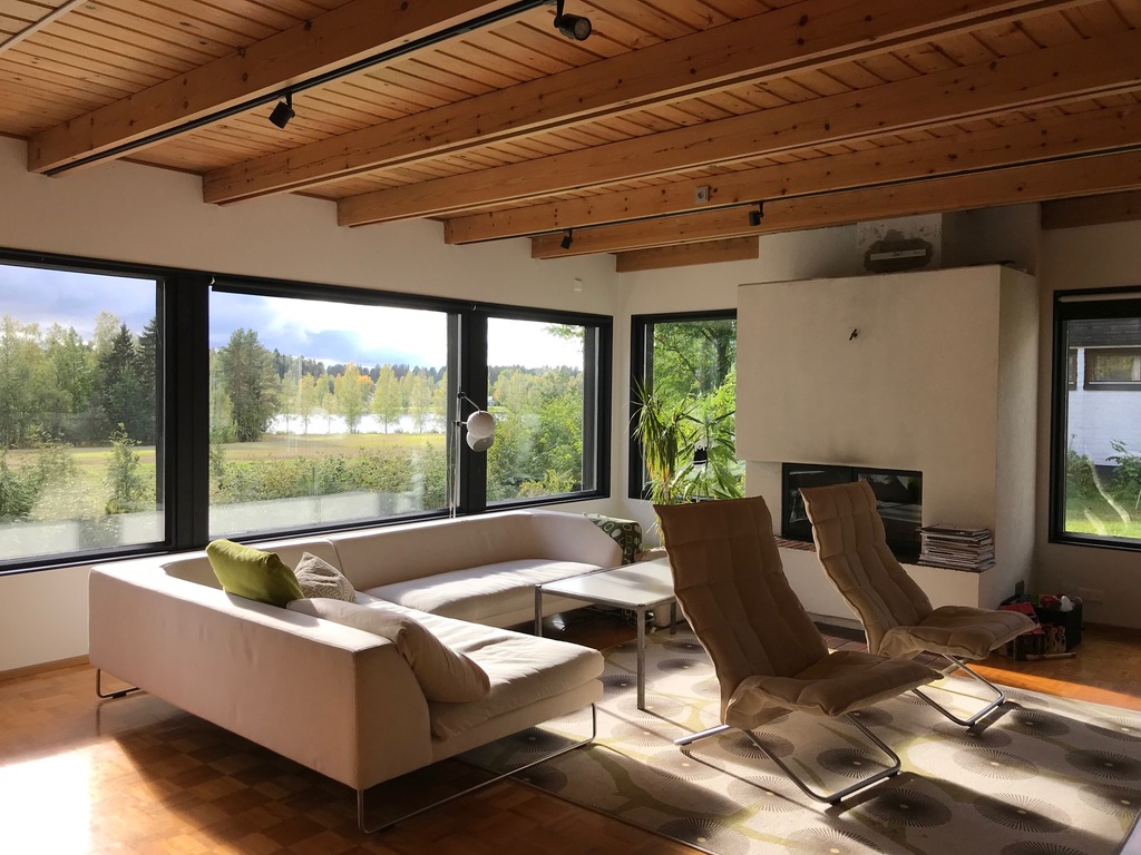 Living room with big windows and view to the river.