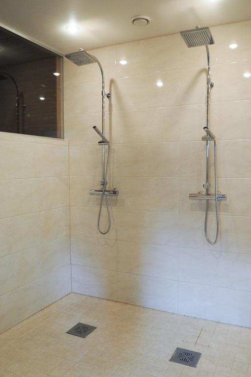 Main shower room with two rain showers