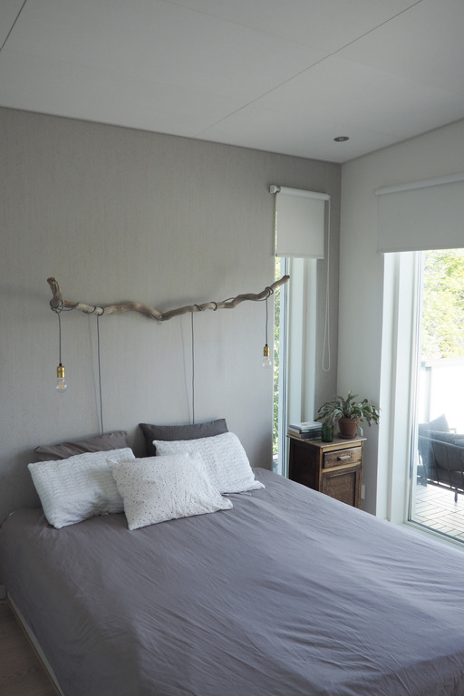 Master bedroom upstairs with access to balcony