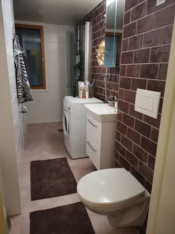  The bathroom with a washing machine.