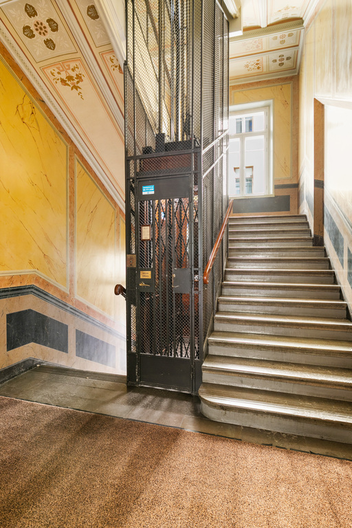 The staircase and the lift to the 4th floor.