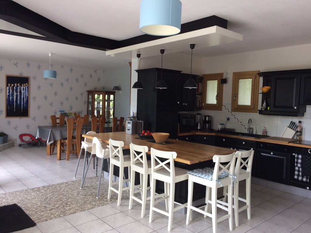 The light well-equipped kitchen and a large dining room