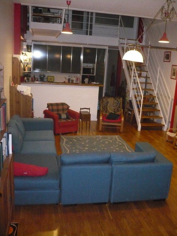 Another view of the living room (with the kitchen in the back)