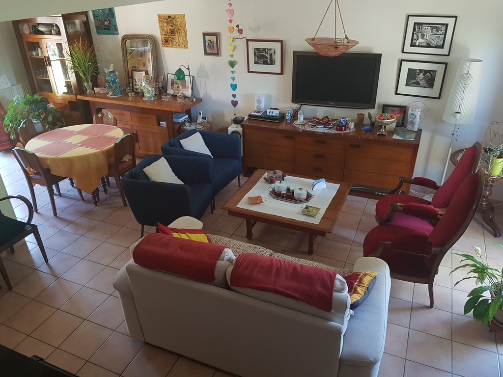 The living room and the dining room from the stairs.