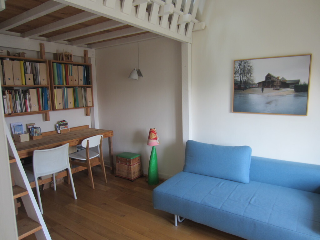 desk and small living room in the parents bedroom