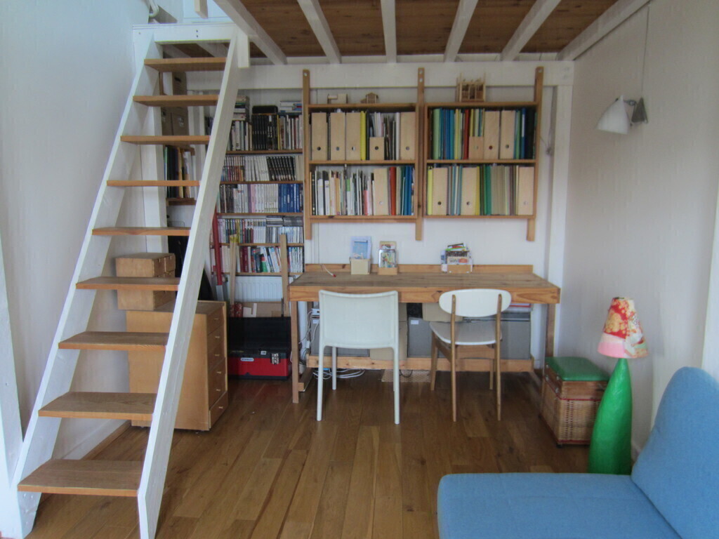 desk and small living room in the parents bedroom