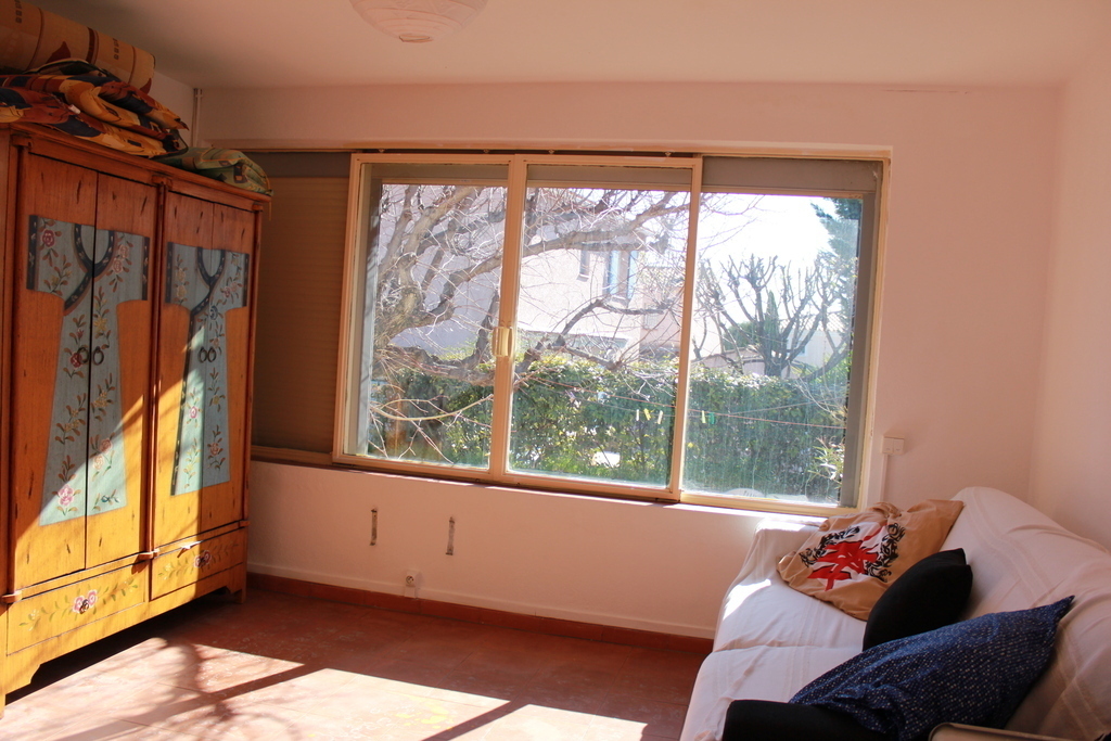 view of the annex buiding, on the right there is a convertble queen size sofa.