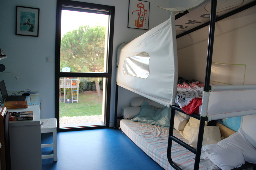 Blue bedroom with a bunk bed