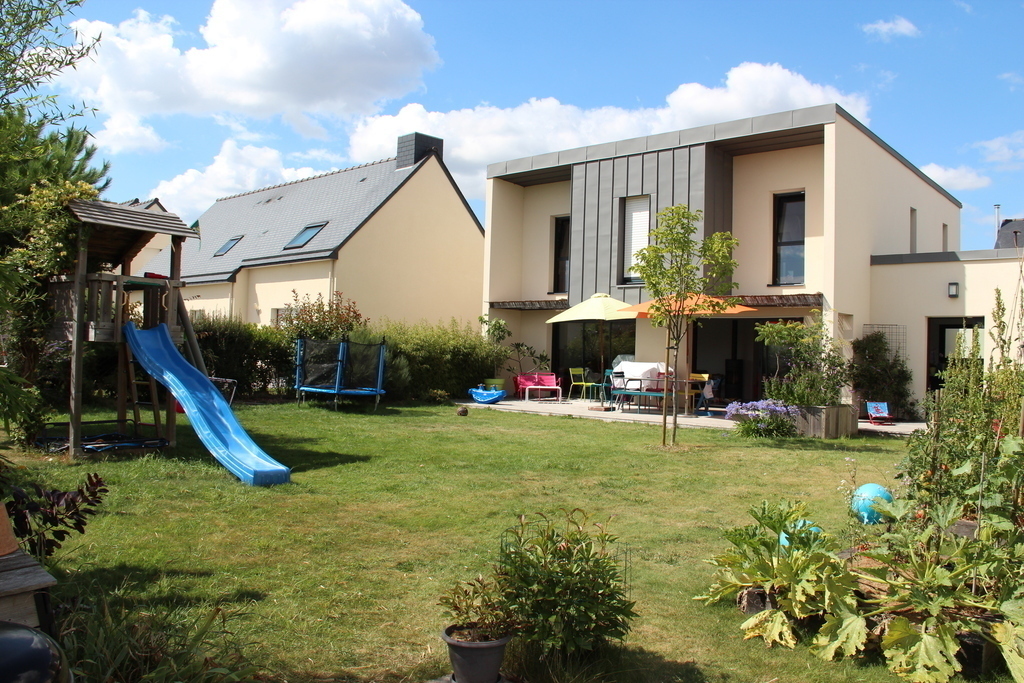The house seen from the garden, with playgroung, terrace, barbecue