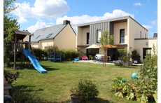 The house seen from the garden, with playgroung, terrace, barbecue