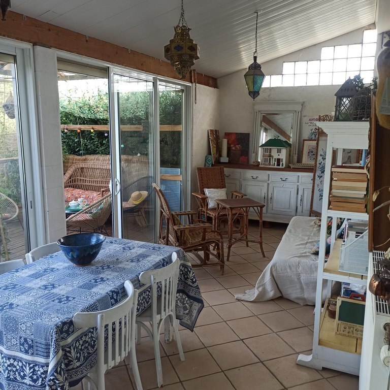 the veranda  is opened on a terrace and the garden 