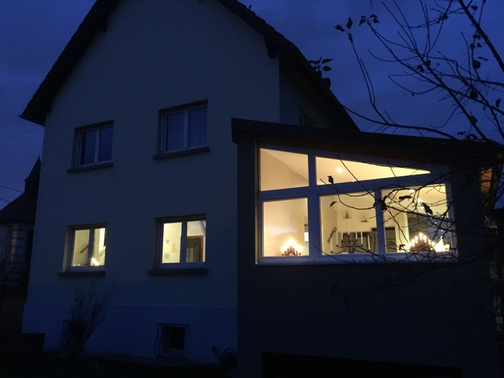 House and living room from the garden, at night...