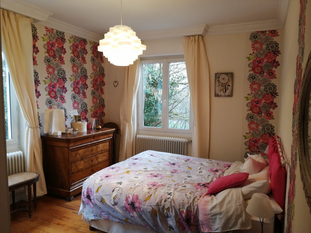 a bedroom with a king size bed