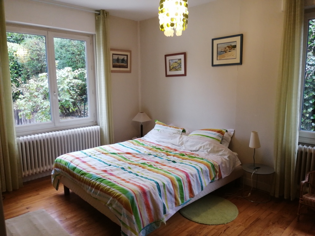 a bedroom with a king size bed