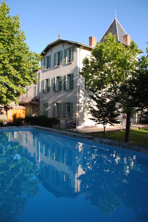 The swimmimg pool and the building: a former priory